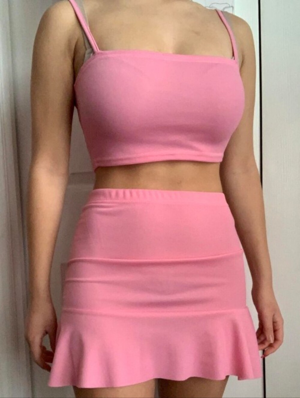 Pink top and skirt set.